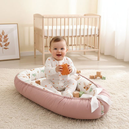 BEBE ASSIS DANS NOTRE REDUCTEUR DE LIT BEBE DEERBABYNEST