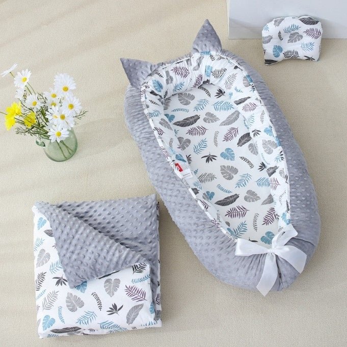 NOTRE REDUCTEUR DE LIT POUR BEBE SOOTHINGFOLIAGE™