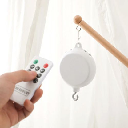 Télécommande de notre boîte musicale rotative pour mobile bébé avec volume réglable
