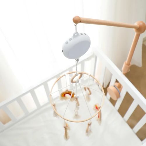 Zoom sur notre boîte musicale rotative pour mobile bébé avec télécommande et volume réglable