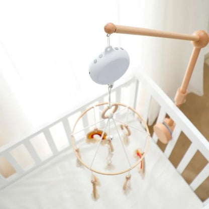Zoom sur notre boîte musicale rotative pour mobile bébé avec télécommande et volume réglable